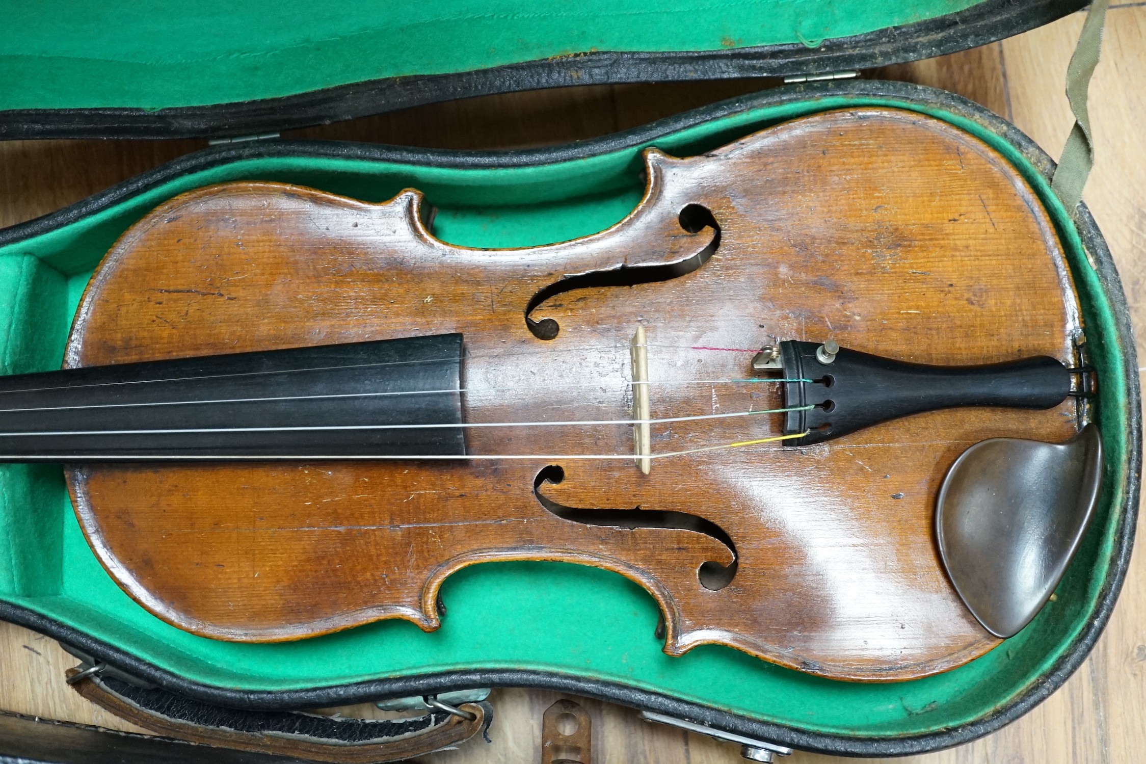 A late 19th century German violin together with an Italian mandolin, (both cased)
